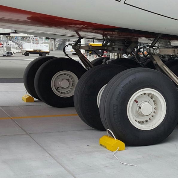 Polyurethane aviation aircraft wheel chocks in use
